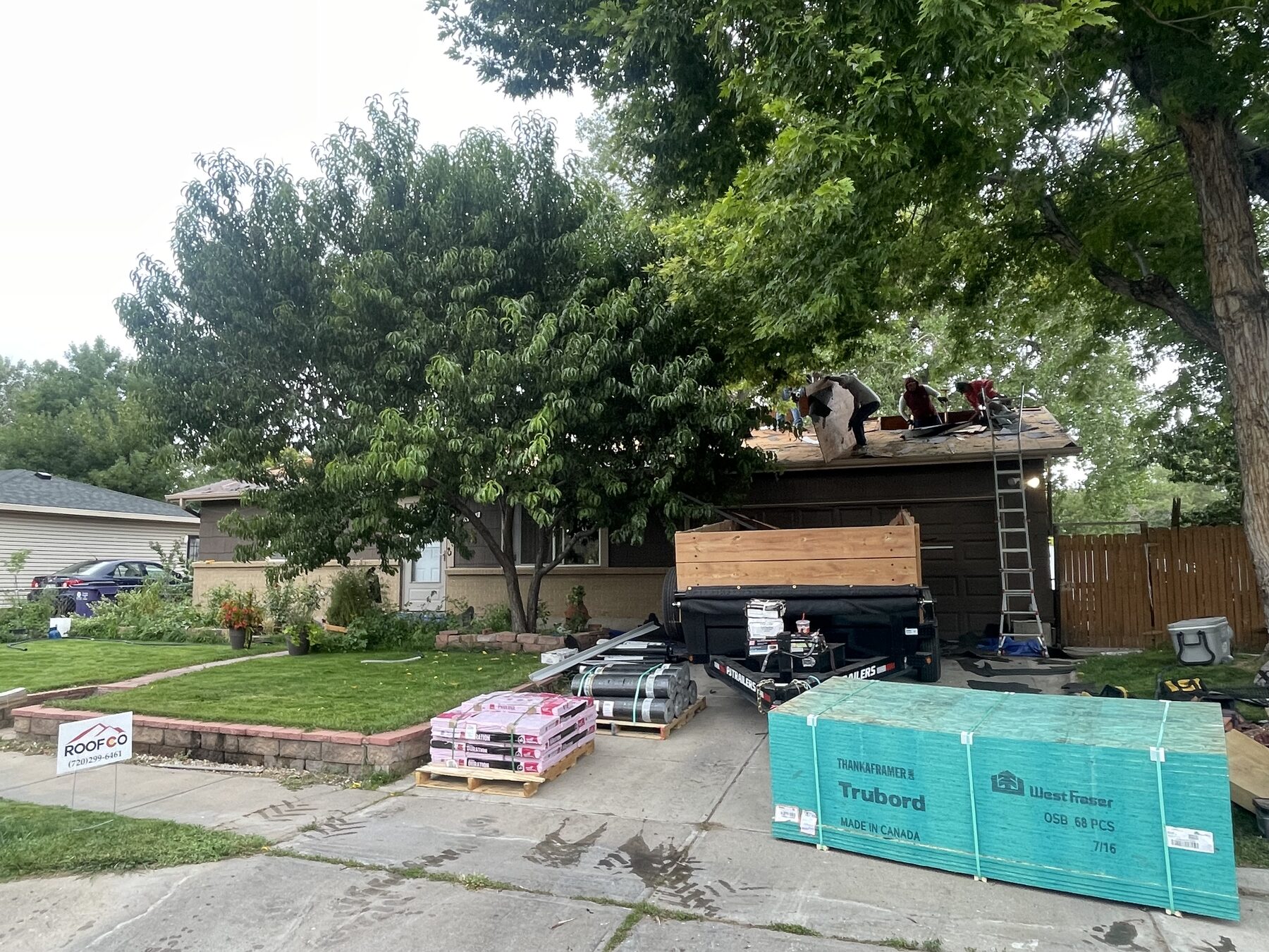 Roofco crew installing new roof on Denver-area home