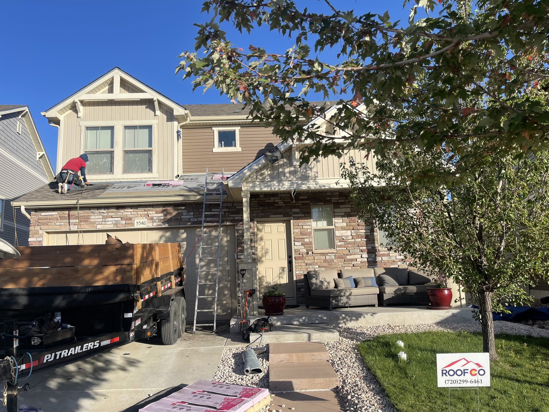 Roofco crew working on a Denver-area residential roof