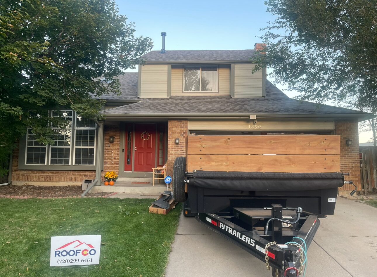 Roofco residential job site with yard sign, Denver