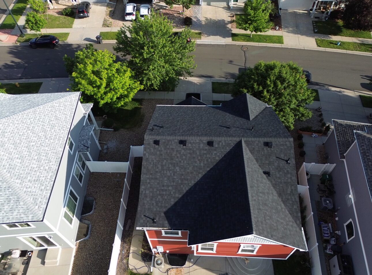 Roofco crew installing new shingles, Denver