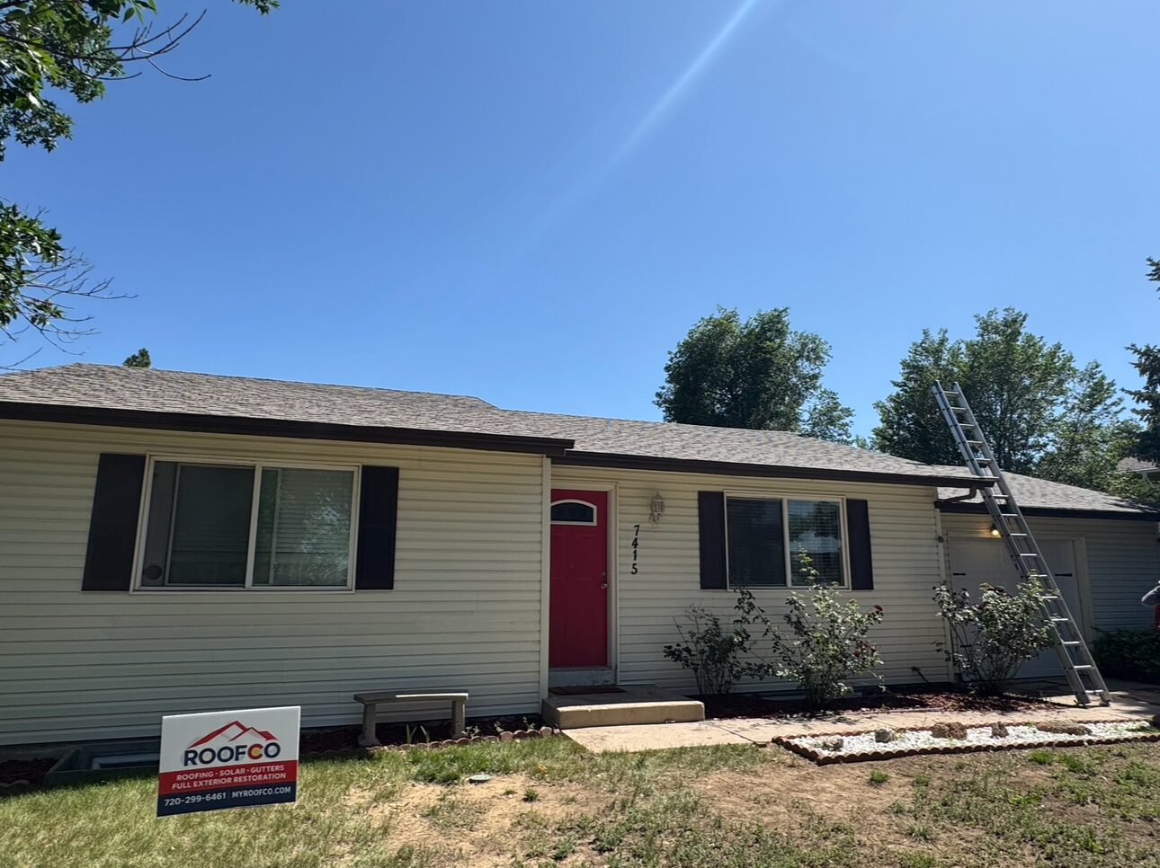 Roofco crew on residential roof, Colorado