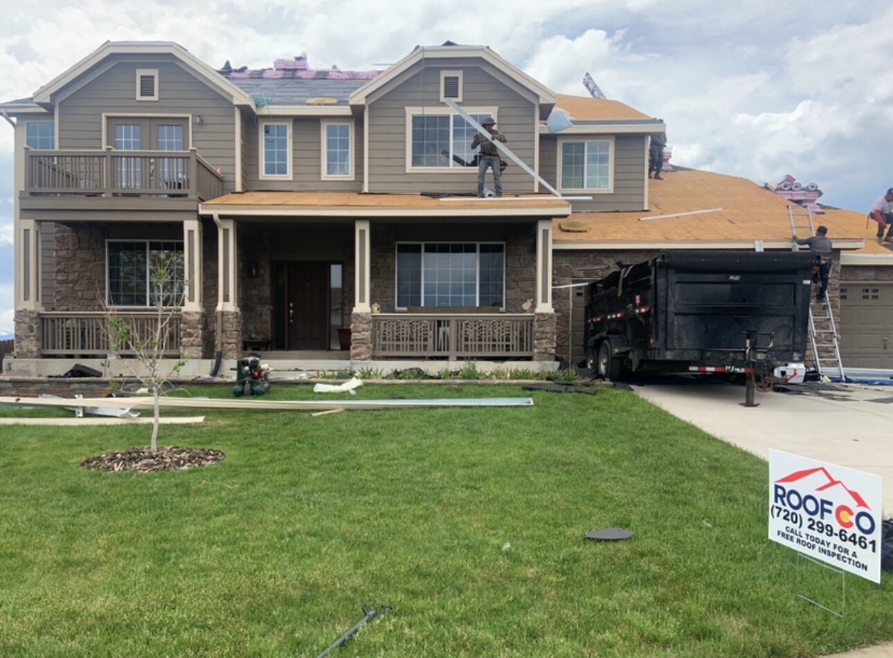 Roofco trailer and crew on residential job, Denver