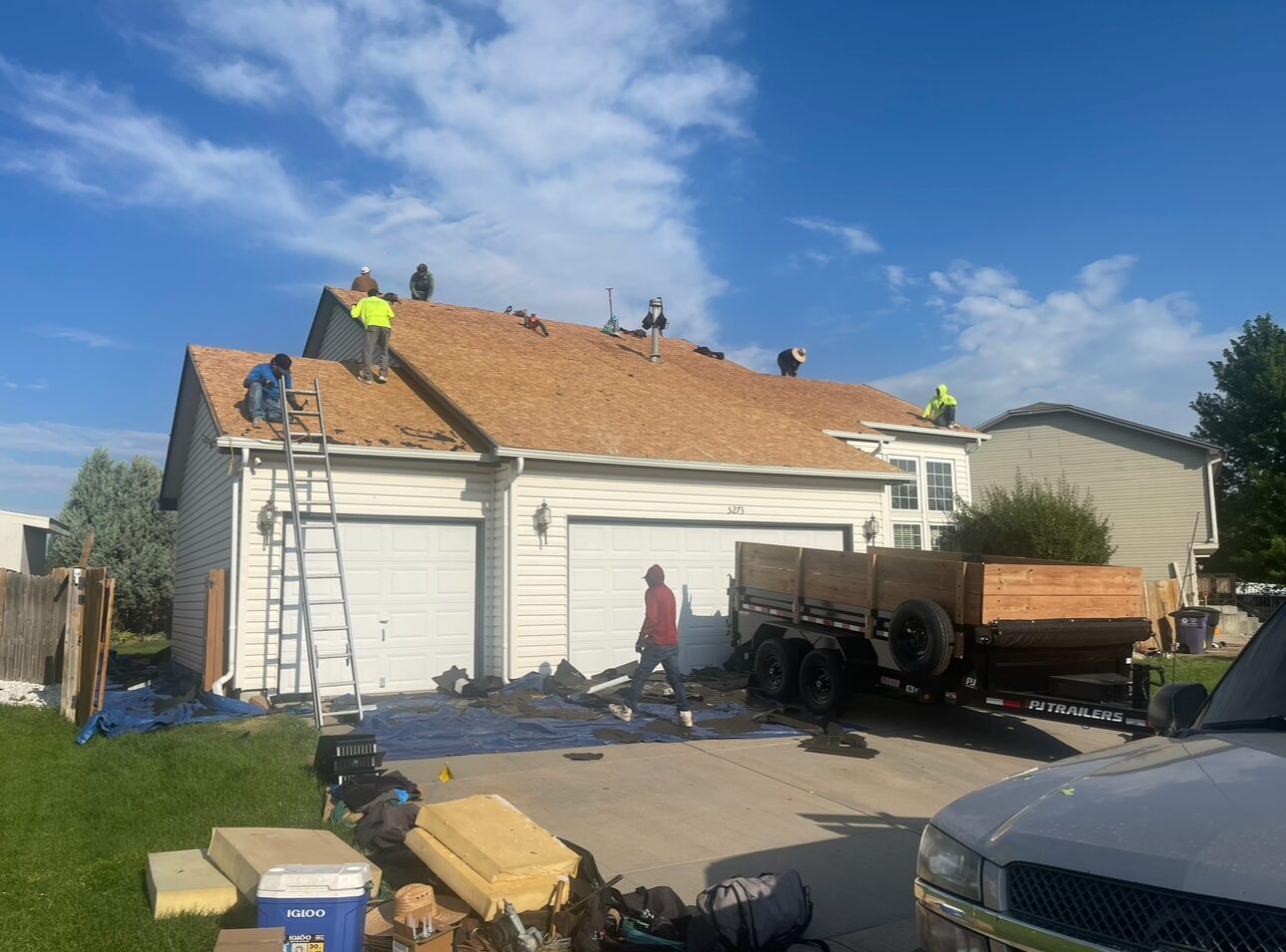 Roofco crew working on a Denver-area home